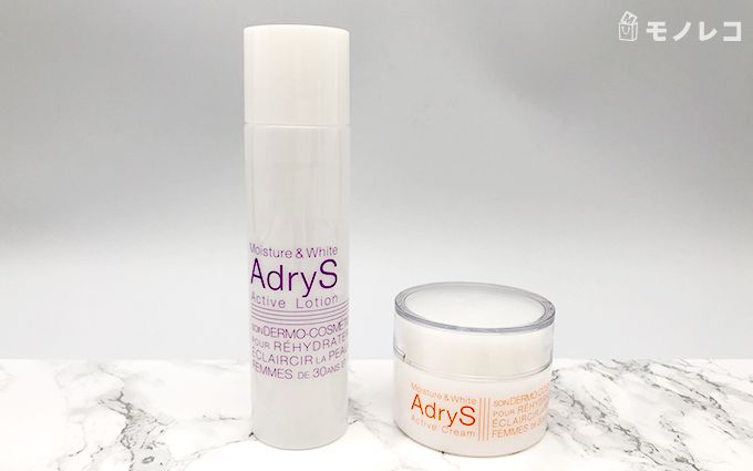 AdryS(アドライズ)のアクティブローションとアクティブクリームが大理石の上に置かれている画像
